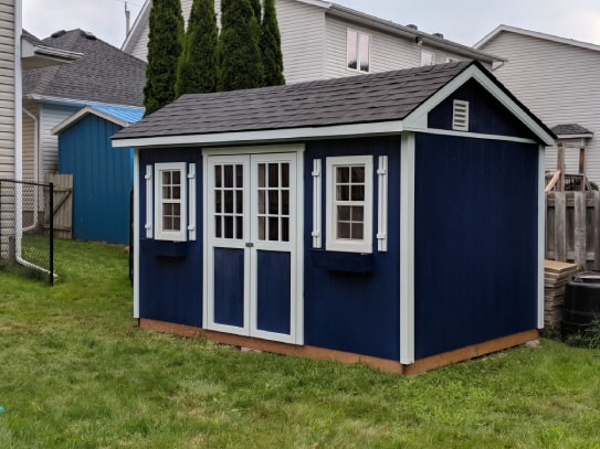 Custom Blue Haliburton Cottage Shed With White Trims